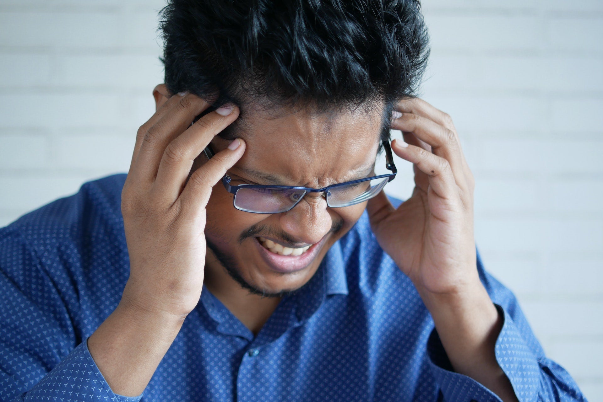 Man suffering from migraine headache